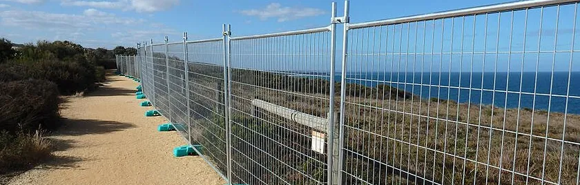 wire mesh fence with stones